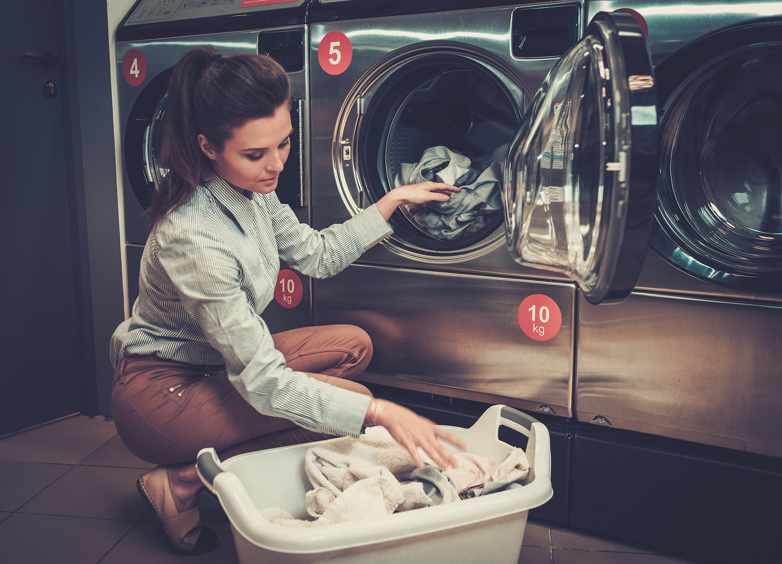 Beautiful Woman Doing Laundry At Laundromat Shop T And L Equipment Sales Co Inc Commercial
